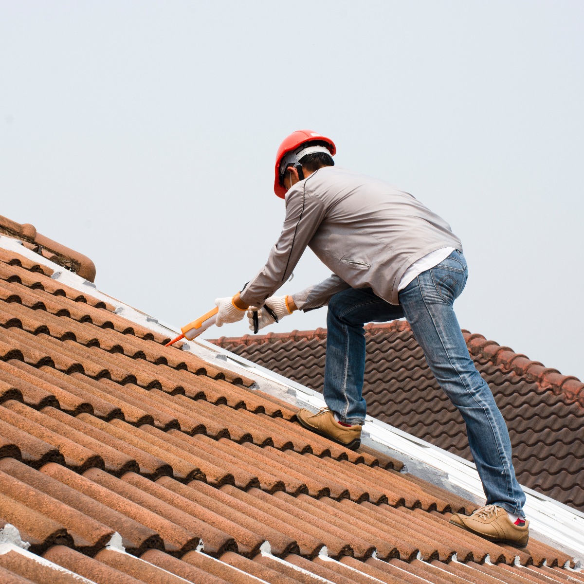roofer fixing tile roof